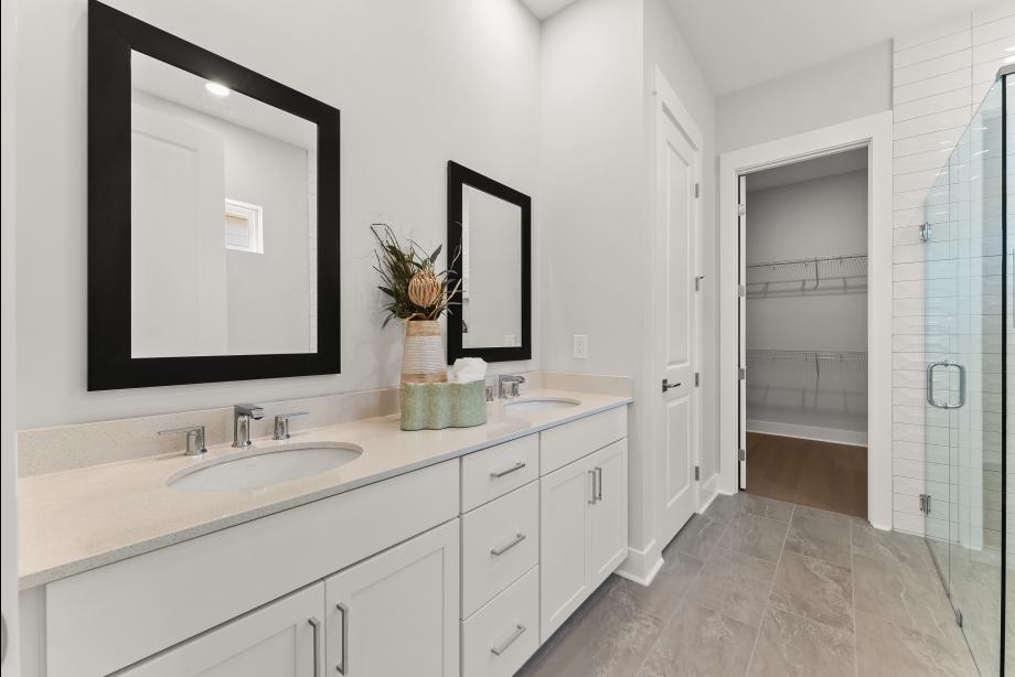 Luxurious primary bath with dual vanities and spa-like features