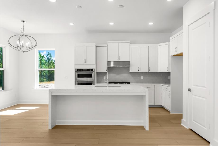 Well-equipped kitchen with white cabinets and ample countertop space