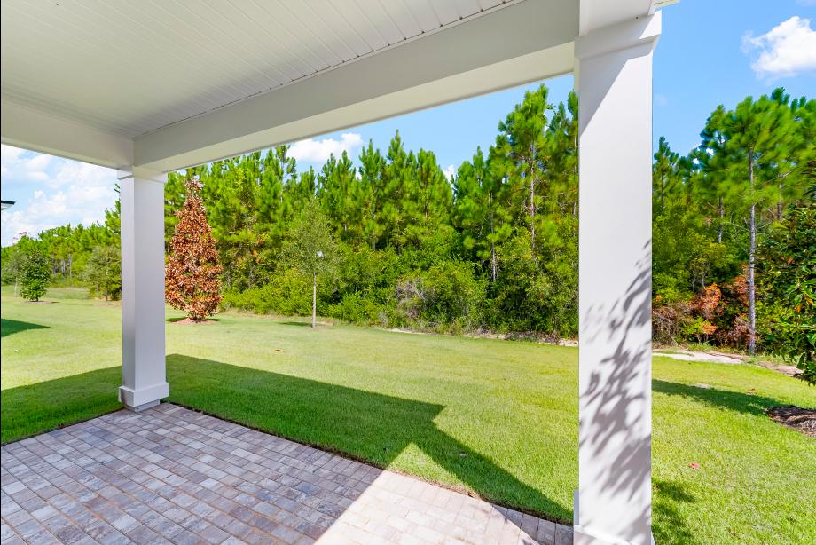 Covered lanai ideal for outdoor living, dining, and entertaining