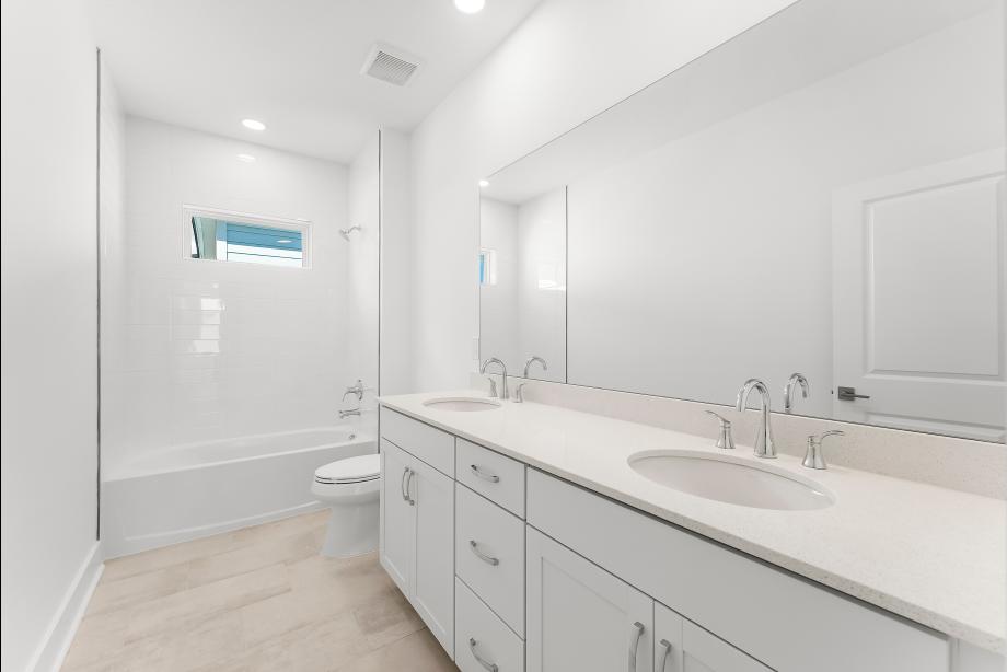 Large secondary bathroom with a dual-sink vanity
