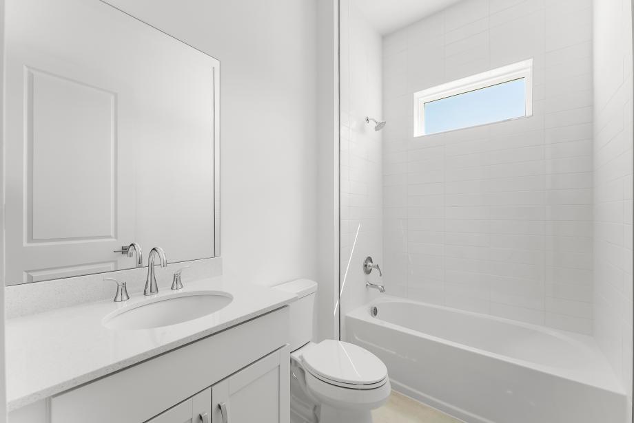 Secondary bathroom with a tub/shower combo