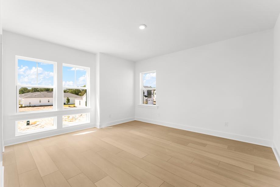 Spacious secondary bedroom suite with a walk-in closet