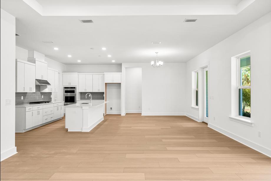 Open-concept floor plan with a casual dining area adjacent to the kitchen