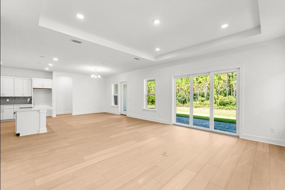 Spacious great room with a multi-sliding glass door
