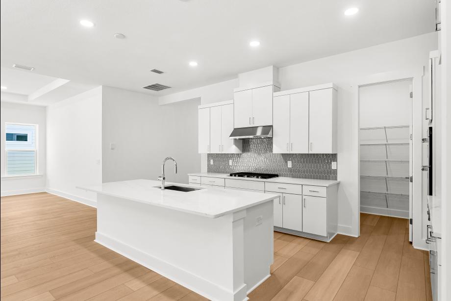 Well-equipped kitchen with white cabinets and ample countertop space