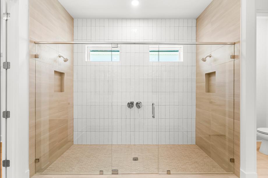 Lavish primary bathroom with a large walk-in shower