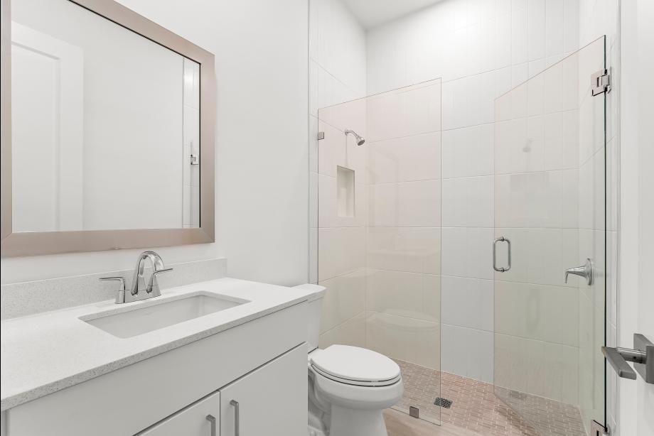 Secondary bathroom with a walk-in shower