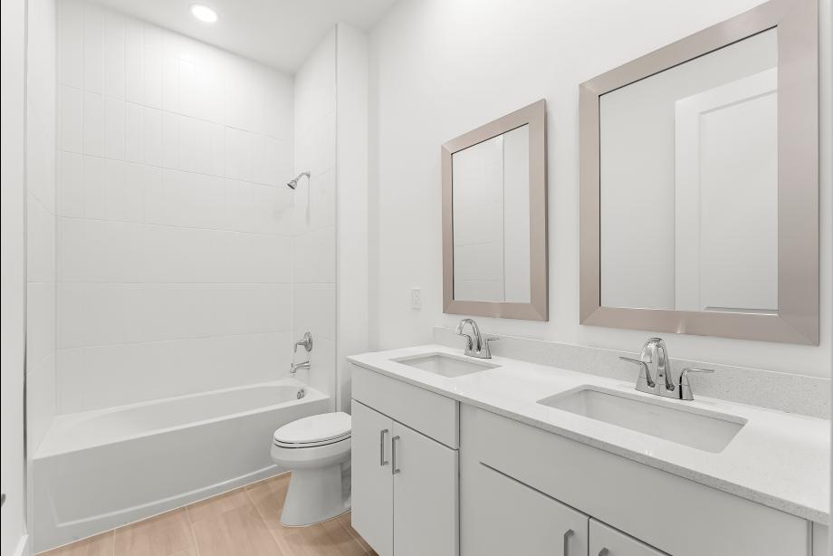Secondary bathroom with dual-sink vanity