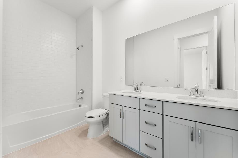 Beautiful secondary bathroom with a dual-sink vanity
