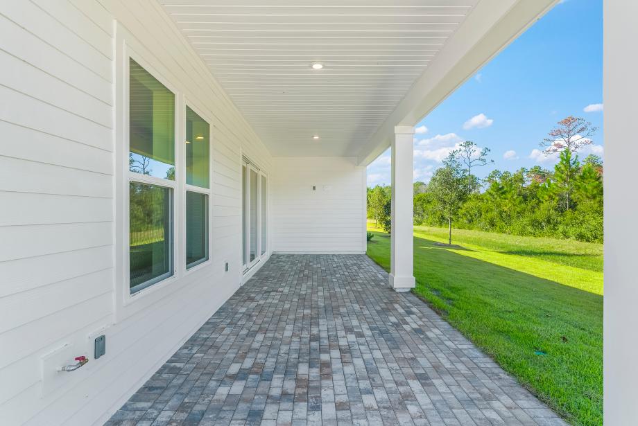 Covered lanai ideal for outdoor living, dining, and entertaining