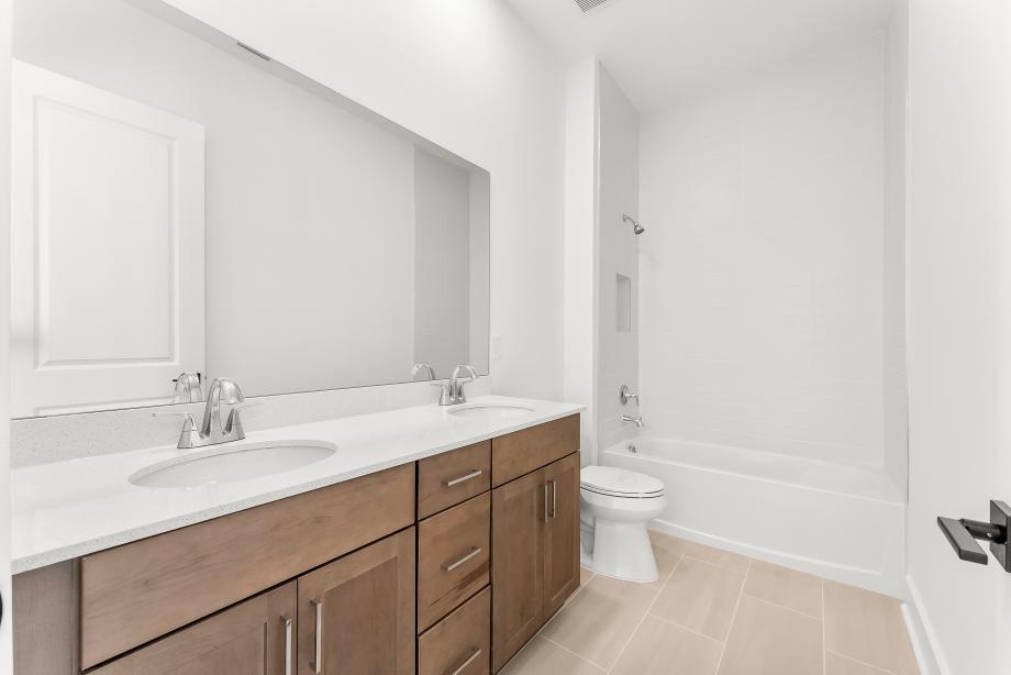 Secondary bathroom with a dual-sink vanity