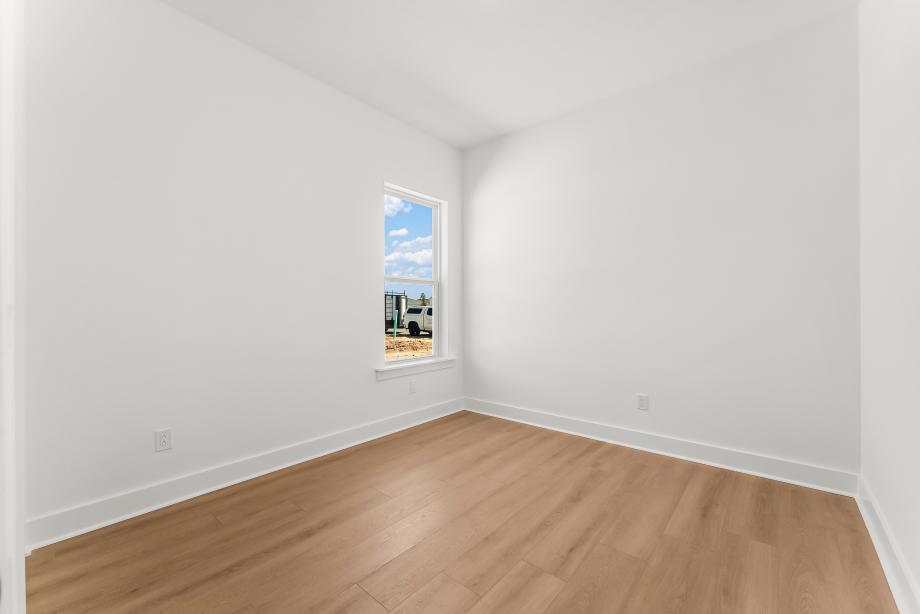 Spacious secondary bedroom suit with a walk-in closet
