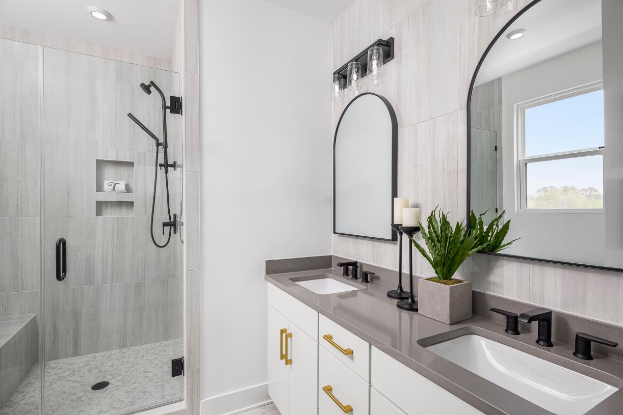 Spa-like primary bathroom with dual sinks