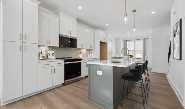 Spacious kitchen with two-toned cabinets