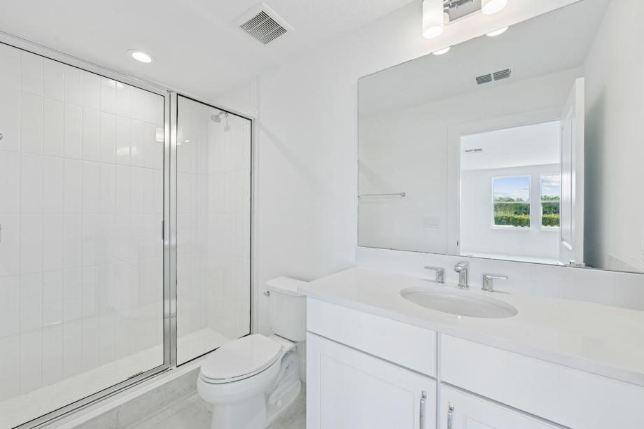 Fresh, clean, and effortlessly modern secondary bathroom
