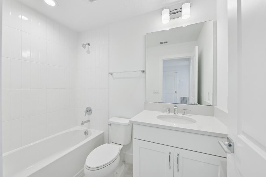 Fresh, clean, and effortlessly modern secondary bathroom