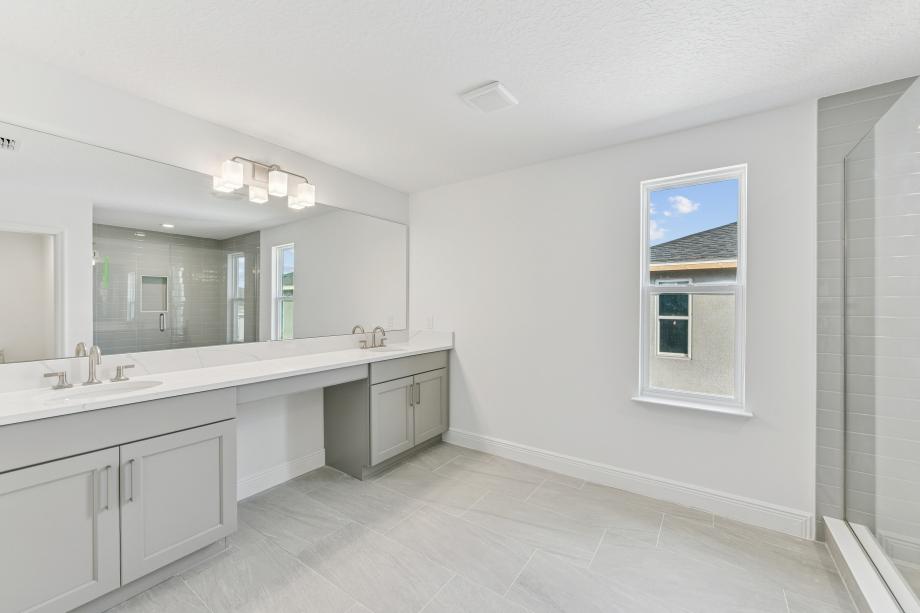 Primary bathroom with clean lines and calming finishes