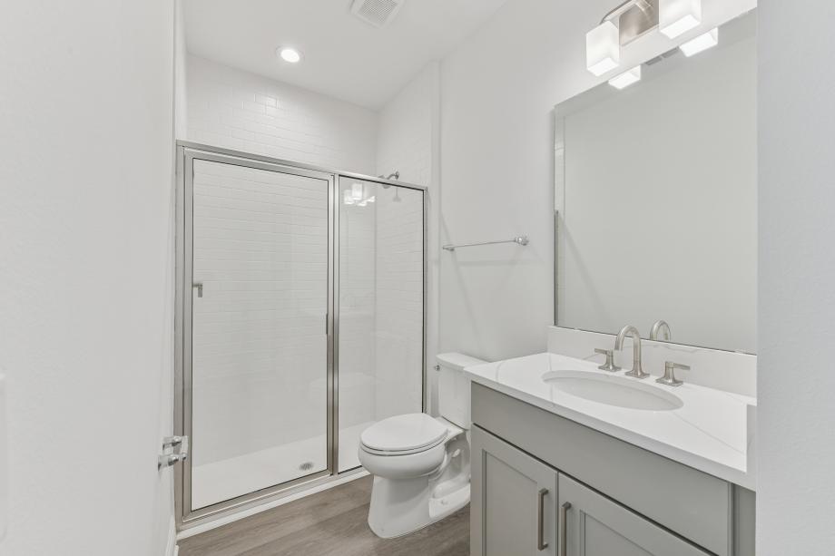 Fresh, clean, and, effortlessly modern secondary bathroom