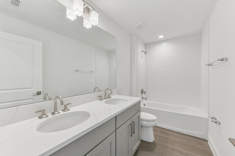 Fresh, clean, and effortlessly modern secondary bathroom