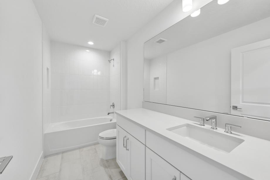 Fresh, clean, and, effortlessly modern secondary bathroom