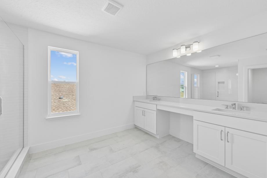 Primary bathroom with clean lines and calming finishes