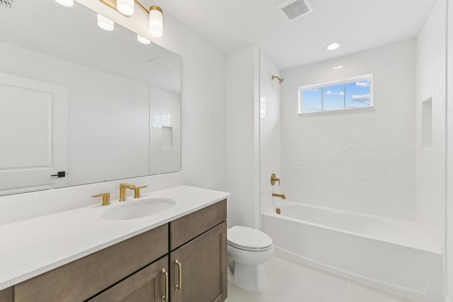 Fresh, clean, and effortlessly modern secondary bathroom