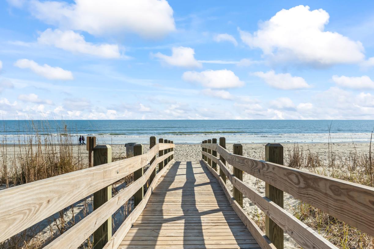 Just a short walk or quick golf cart ride to Cherry Grove Beach