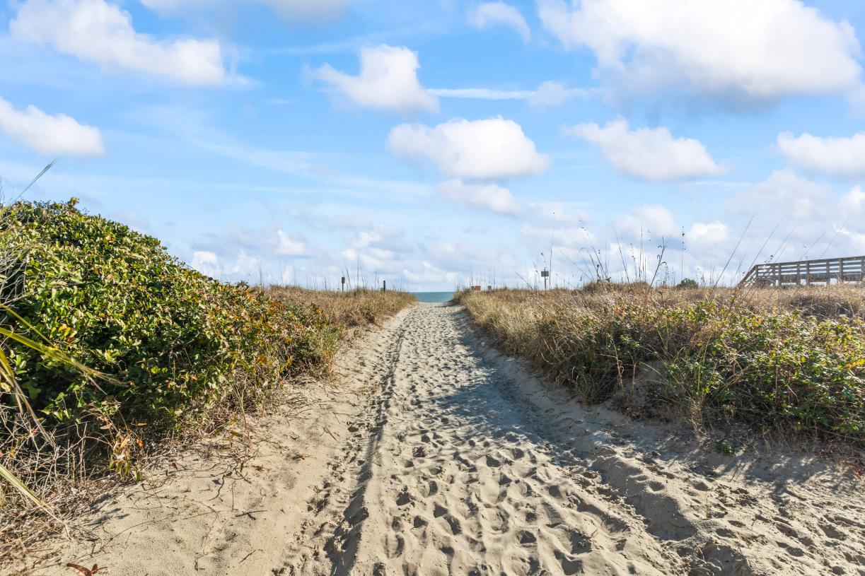 Within walking distance to public beach access