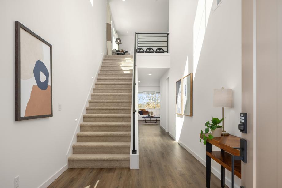 Dramatic two-story foyer with contemporary metal railing