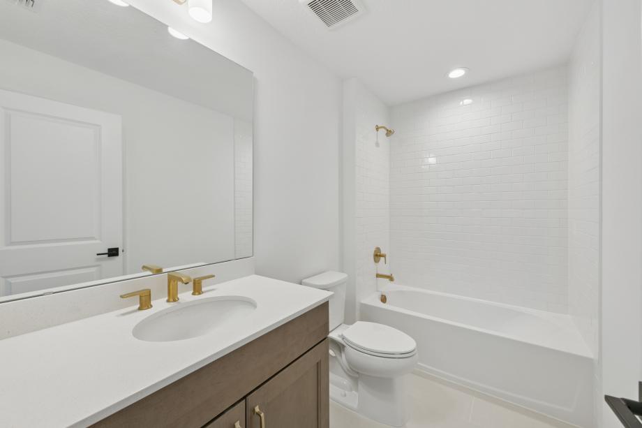 A sleek, modern secondary bathroom