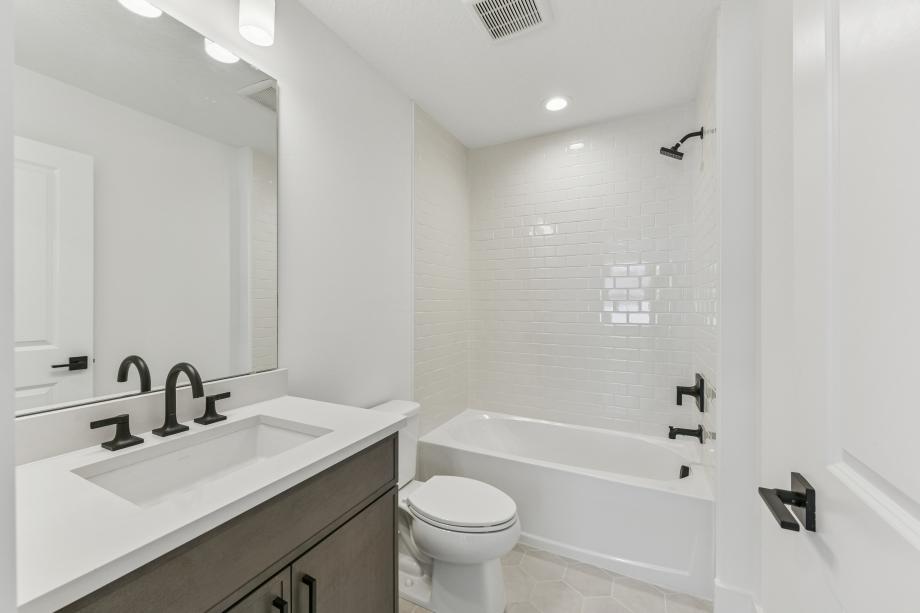 A sleek, modern secondary bathroom