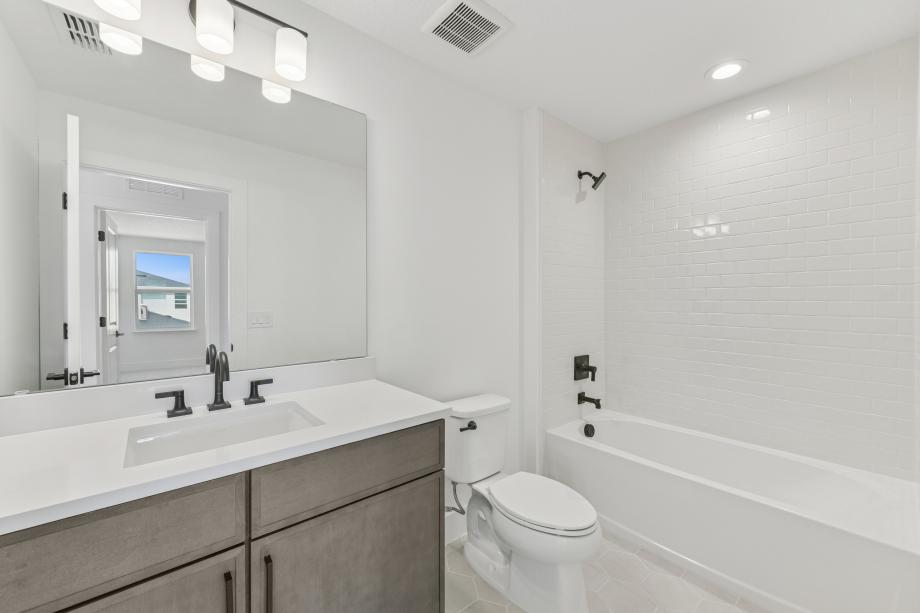 A well-placed guest bath with polished appeal