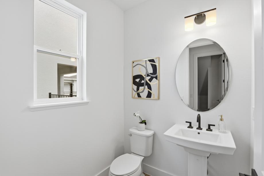 The Powder room makes a stylish statement with thoughtfully selected details and polished designs