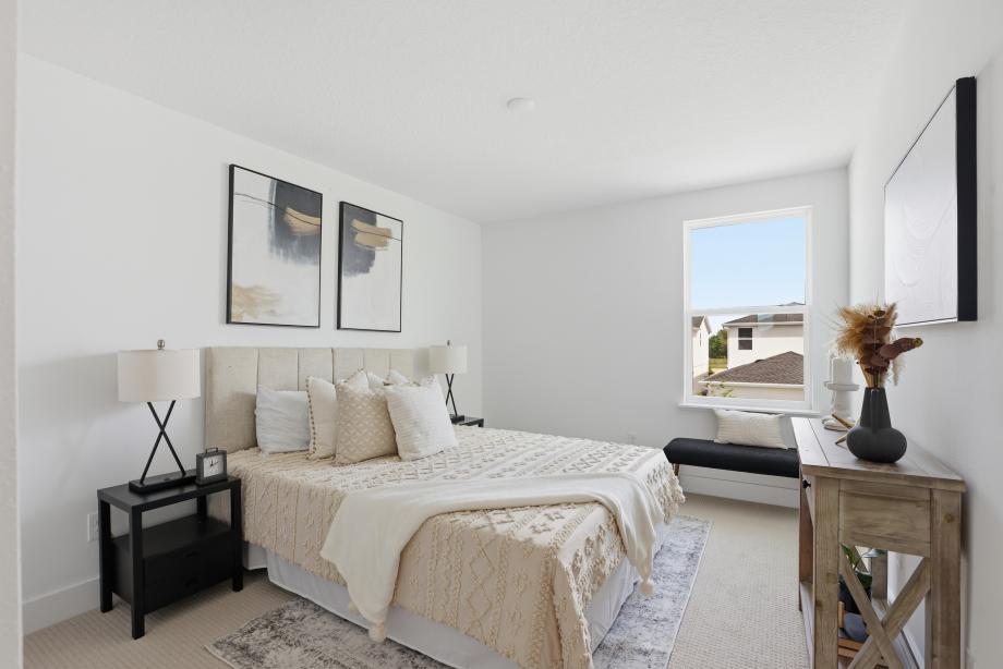Well appointed and versatile, the secondary bedroom offers comfort, privacy, and timeless appeal