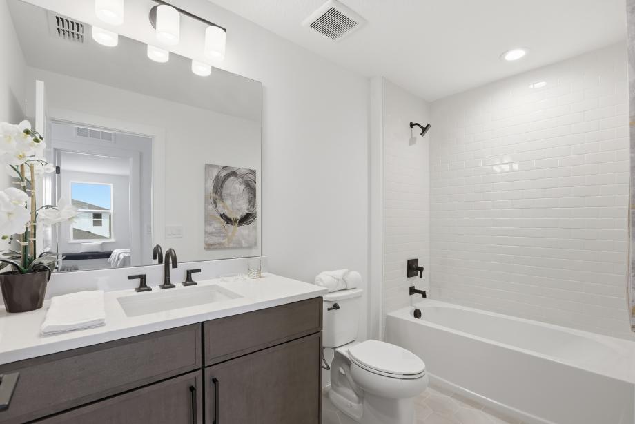 A sleek, modern secondary bathroom