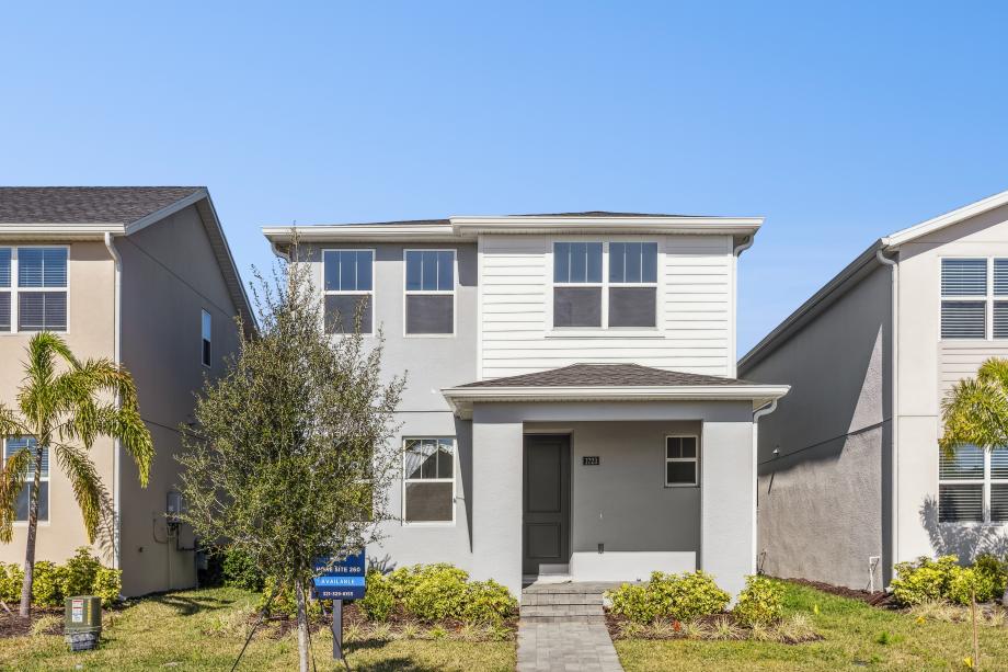 A beautifully designed suburban exterior boasting a charming front porch