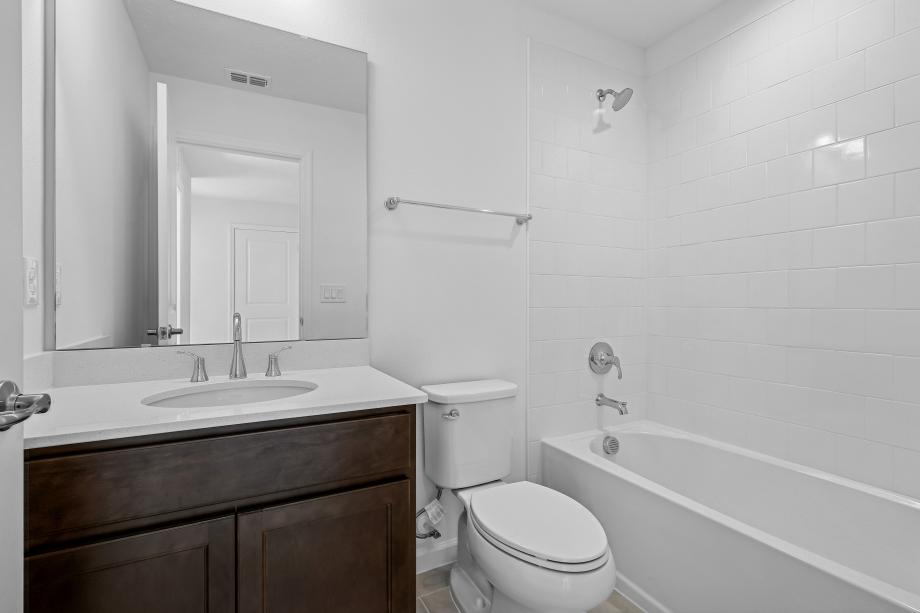 A sleek, modern secondary bathroom