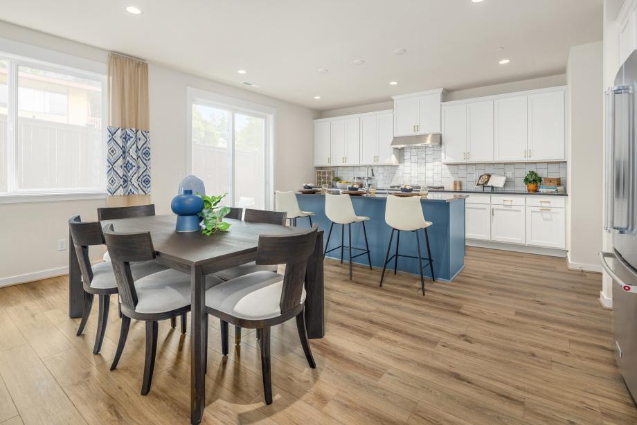 White shaker cabinets complemented by a blue island