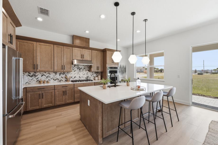 Kitchen blends cooking and socializing, with a large center island offering ample seating