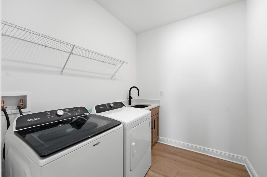Laundry room offers a well-organized space for everyday tasks
