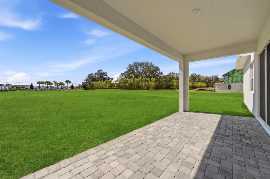 The covered outdoor living area extends the home's entertaining potential