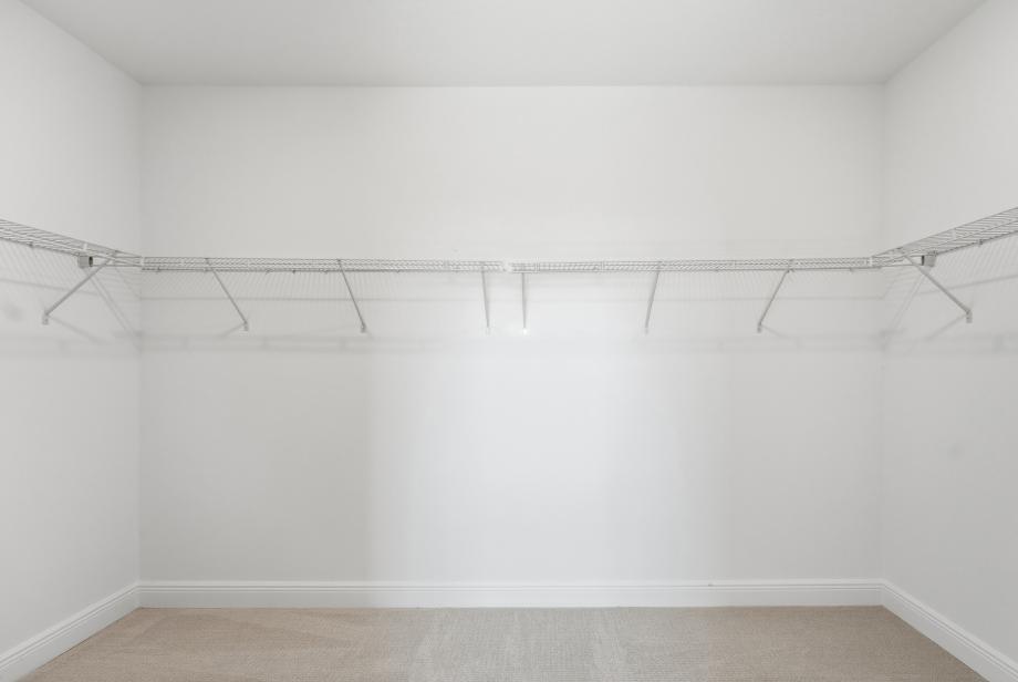 Walk-in closet offers a boutique-style feel with ample room for wardrobe organization