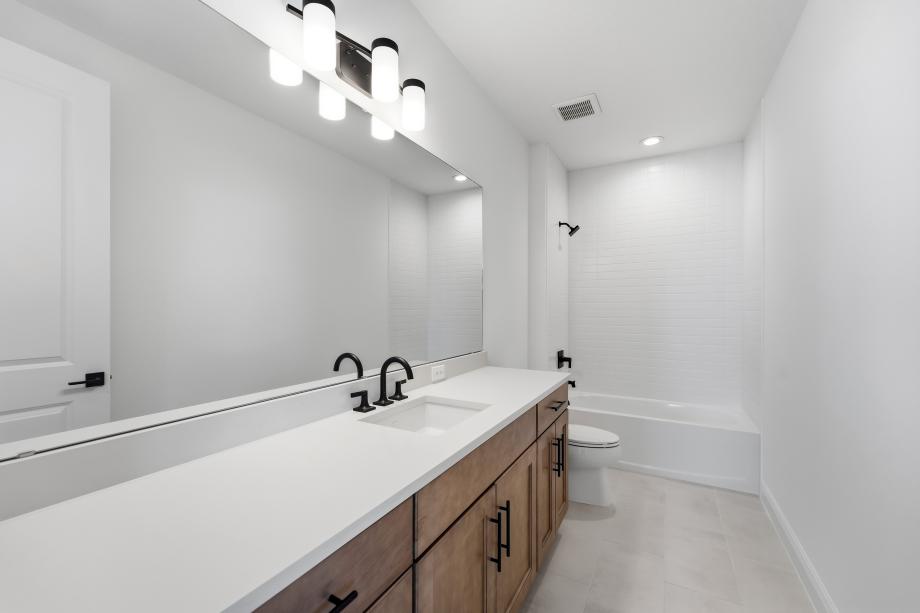 Fresh, clean, and effortlessly modern secondary bathroom