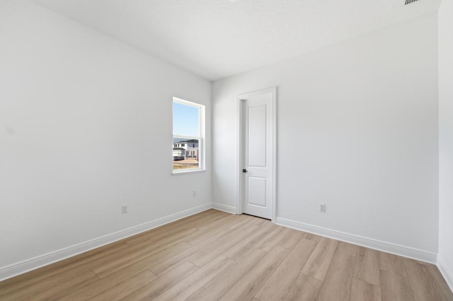 Bright, functional, and inviting secondary bedroom