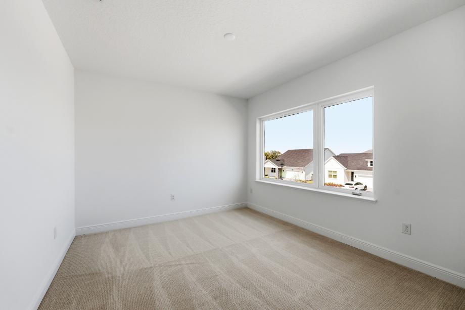 Bright, functional, and inviting secondary bedroom