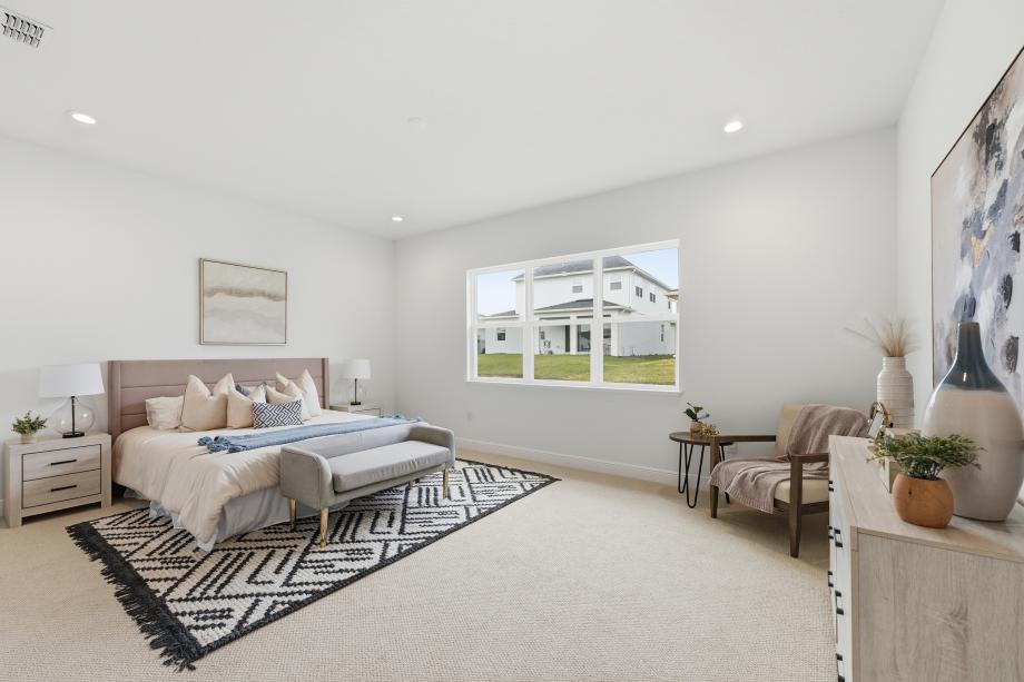 Clean lines and calming finishes in this first floor primary bedroom