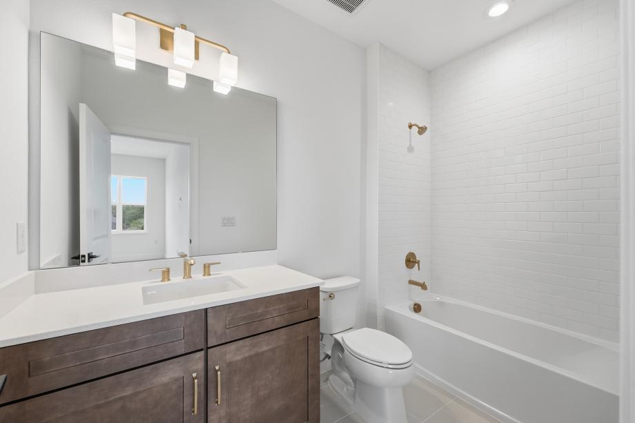 Fresh, clean, and effortlessly modern secondary bathroom