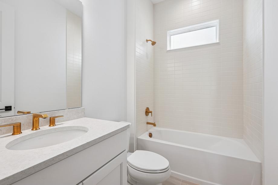 Fresh, clean, and effortlessly modern secondary bathroom