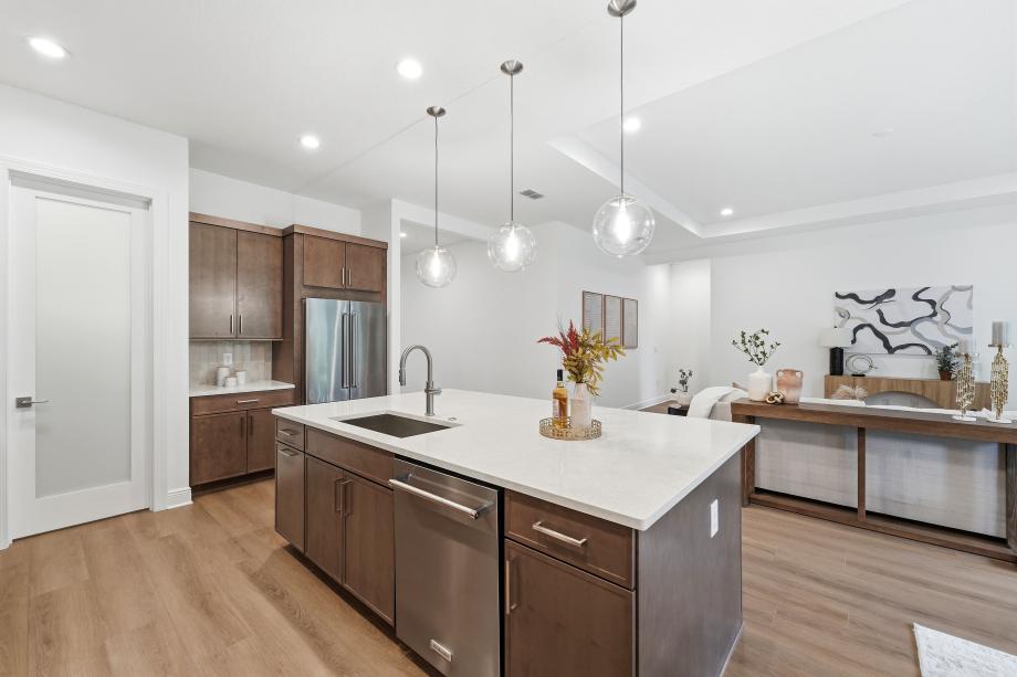 Gourmet kitchen boasting a large center island with quartz countertops