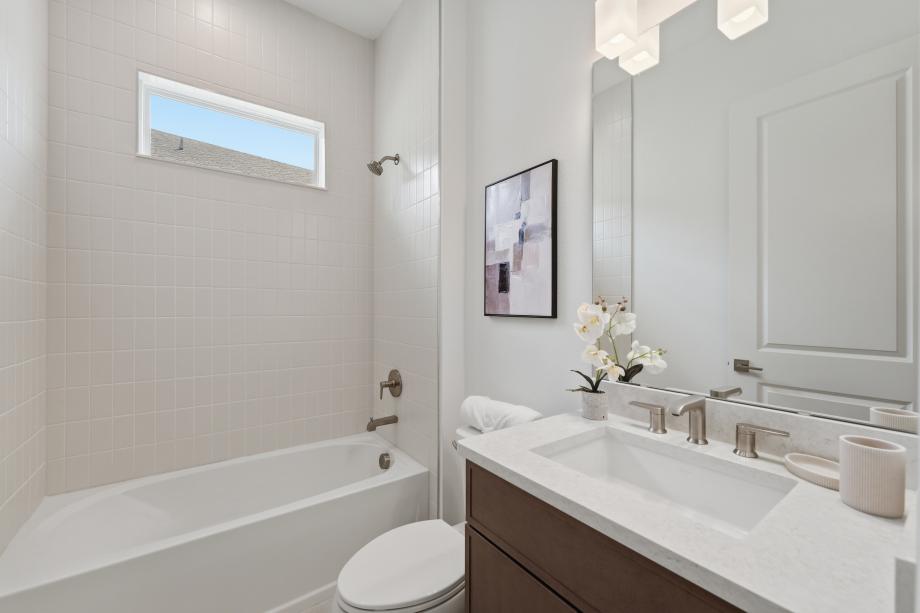 A sleek, modern secondary bathroom
